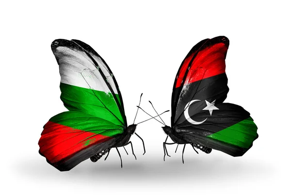 Farfalle con le bandiere di Bulgaria e Libia sulle ali — Foto Stock