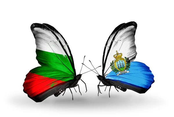 Butterflies with Bulgaria and San Marino flags on wings — Stock Photo, Image