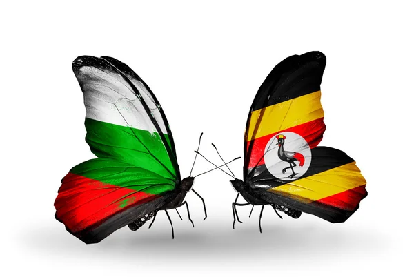 Butterflies with Bulgaria and Uganda flags on wings — Stock Photo, Image