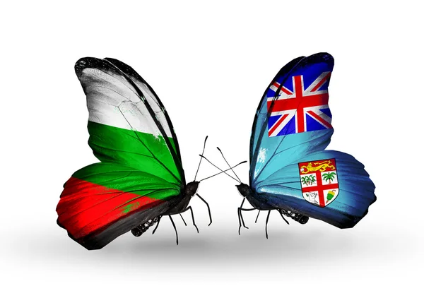Motýli s Bulharskem a Fidži vlajky na křídlech — Stock fotografie