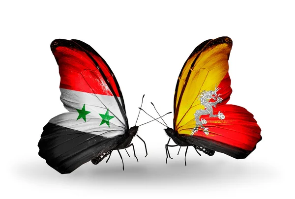 Papillons avec drapeaux Syrie et Bhoutan sur les ailes — Photo