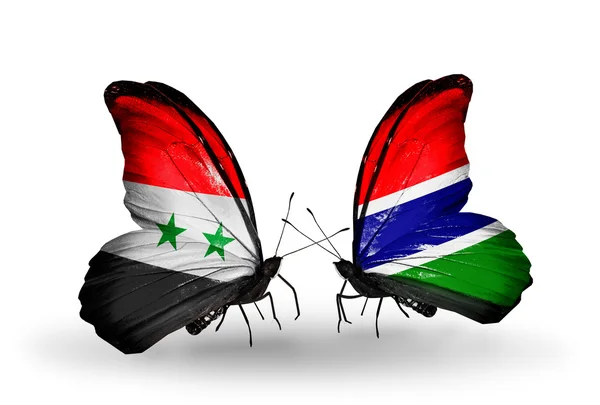 Kelebekler kanat Gambiya ve Suriye bayrakları ile — Stok fotoğraf