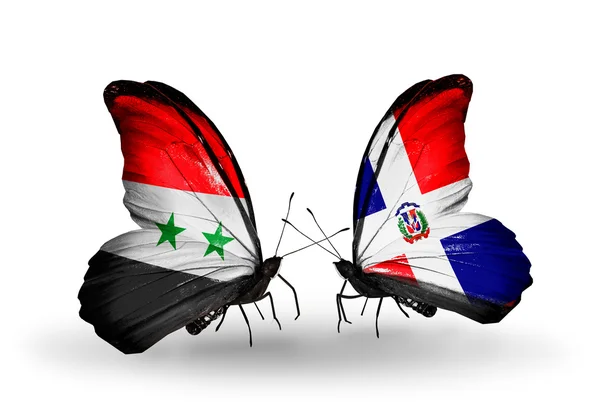 Butterflies with Syria and Dominicana flags on wings — Stock Photo, Image