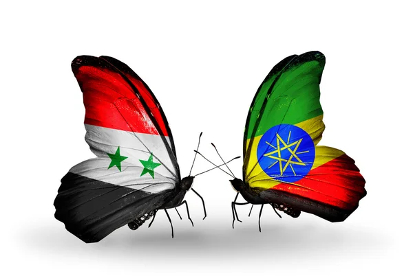 Kelebekler kanat Etiyopya ve Suriye bayrakları ile — Stok fotoğraf