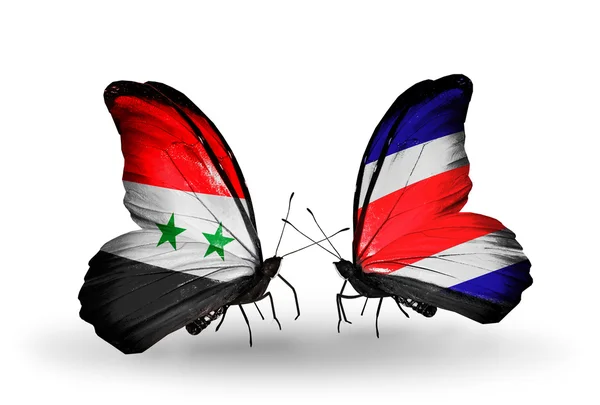 Papillons avec drapeaux Syrie et Costa Rica sur les ailes — Photo