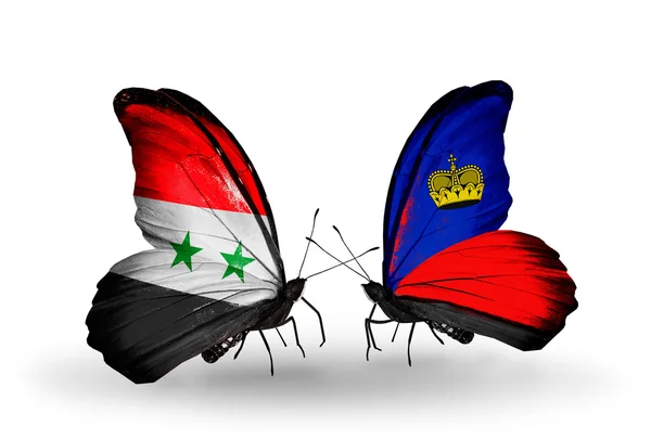 Papillons avec drapeaux Syrie et Liechtenstein sur les ailes — Photo