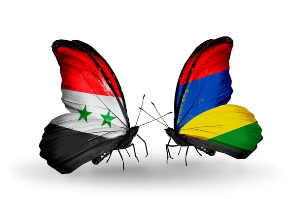 Borboletas com bandeiras da Síria e Maurícia em asas — Fotografia de Stock