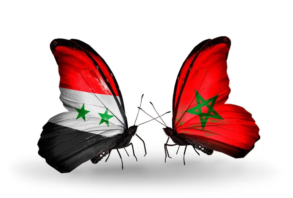 Mariposas con banderas de Siria y Marruecos en alas — Foto de Stock