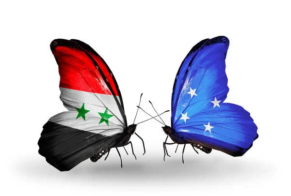 Vlinders met Syrië en micronesia vlaggen op vleugels — Stockfoto