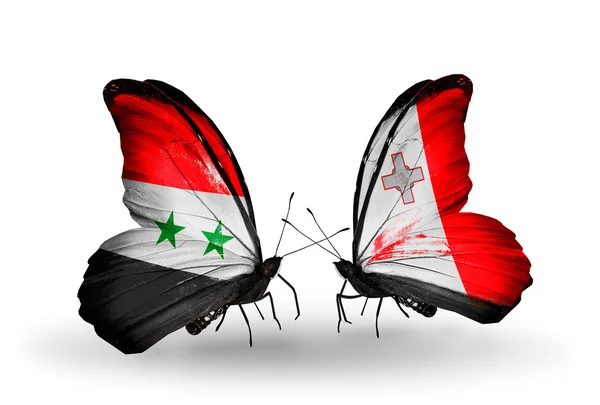 Borboletas com bandeiras da Síria e Malta em asas — Fotografia de Stock
