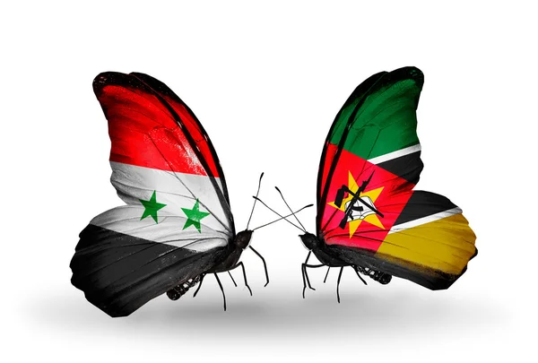 Butterflies with Syria and Mozambique flags on wings — Stock Photo, Image