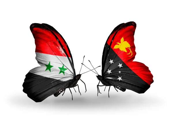 Vlinders met Syrië en Papoea-Nieuw-guinea vlaggen op vleugels — Stockfoto