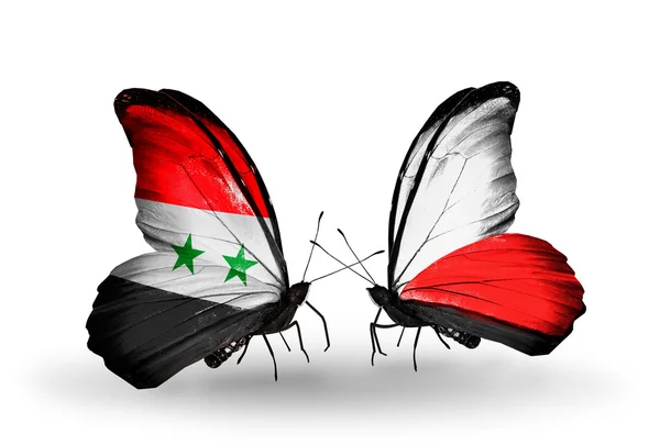 Papillons avec drapeaux Syrie et Pologne sur les ailes — Photo