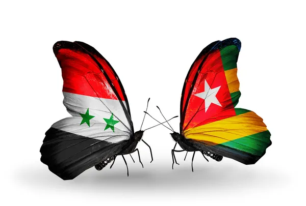 Kelebek kanatları üzerinde Suriye ve togo bayraklı — Stok fotoğraf