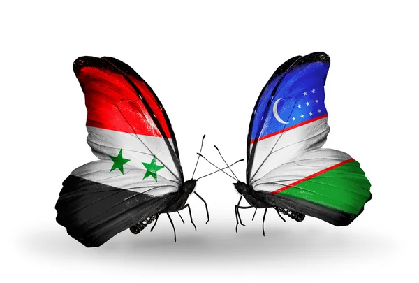 Vlinders met Syrië en Oezbekistan vlaggen op vleugels — Stockfoto