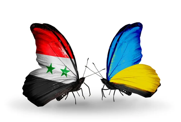 Borboletas com bandeiras da Síria e Ucrânia em asas — Fotografia de Stock