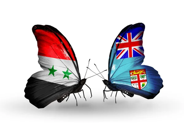 Kelebekler kanat fiji ve Suriye bayrakları ile — Stok fotoğraf