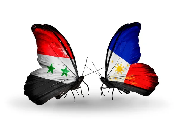 Butterflies with Syria and Philippines flags on wings — Stock Photo, Image