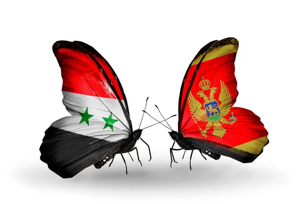 Butterflies with Syria and Montenegro flags on wings — Stock Photo, Image