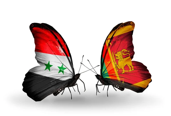 Papillons avec des drapeaux de Syrie et du Sri Lanka sur les ailes — Photo