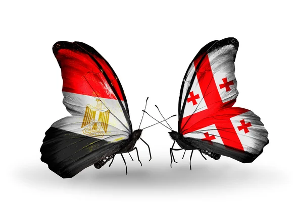 Motýli s vlajkami Egypta a Gruzie — Stock fotografie