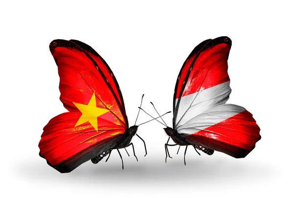 Papillons avec drapeaux Vietnam et Autriche sur les ailes — Photo