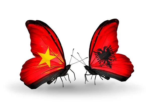 Butterflies with Vietnam and Albania flags on wings — Stock Photo, Image