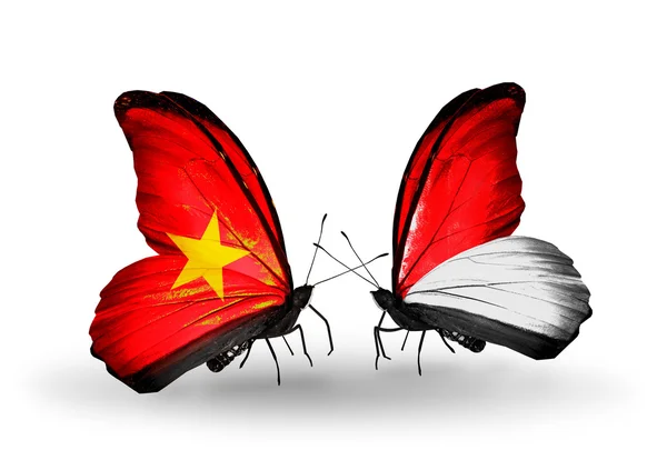 Две бабочки с флагами Вьетнама и Монако, Индонезия — стоковое фото