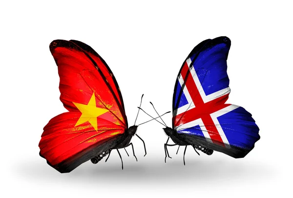 Dva motýli s vlajkami Vietnamu a Islandu — Stock fotografie