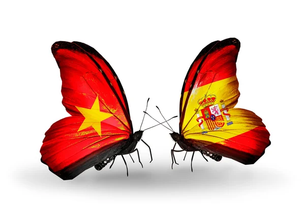Dos mariposas con banderas de Vietnam y España — Foto de Stock
