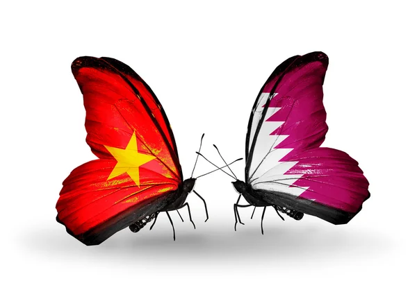 Dwa motyle z flagami i Katar — Zdjęcie stockowe