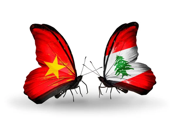 Vietnam ve Lübnan bayrakları taşıyan iki kelebek — Stok fotoğraf