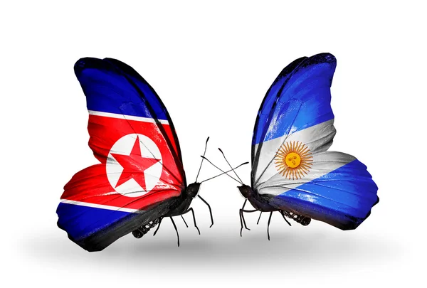 Two butterflies with flags  of  North Korea and Argentina — Stock Photo, Image