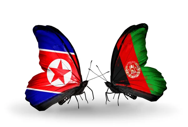 Butterflies with North Korea and Afghanistan flags on wings — Stock Photo, Image
