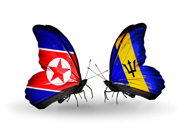 Kuzey Kore ve barbados bayrağı kanatlar üzerinde kelebekler — Stok fotoğraf