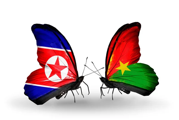 Butterflies with North Korea and Burkina Faso flags on wings — Stock Photo, Image