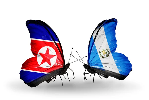 Mariposas con banderas de Corea del Norte y Guatemala en alas —  Fotos de Stock