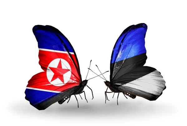 Butterflies with North Korea and Estonia flags on wings — Stock Photo, Image