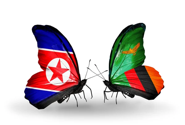 Mariposas con banderas de Corea del Norte y Zambia en alas — Foto de Stock