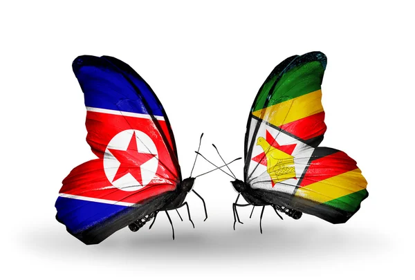 Butterflies with North Korea and Zimbabwe flags on wings — Stock Photo, Image