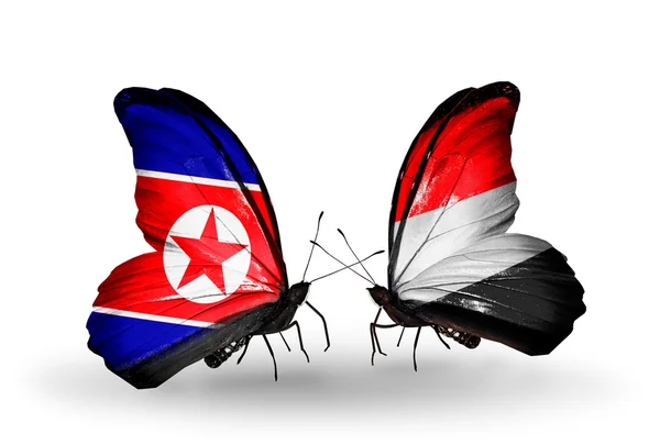 Mariposas con banderas de Corea del Norte y Yemen en alas — Foto de Stock