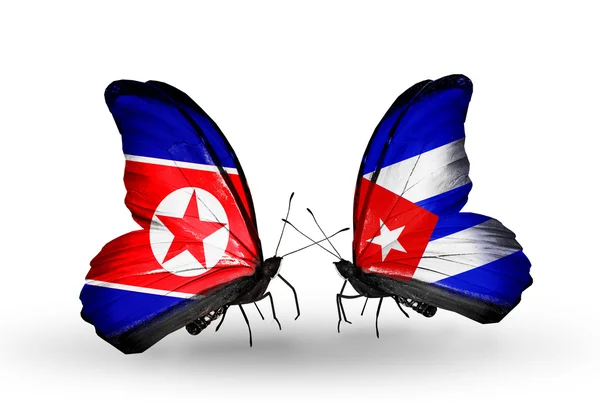 Butterflies with North Korea and Cuba flags on wings — Stock Photo, Image