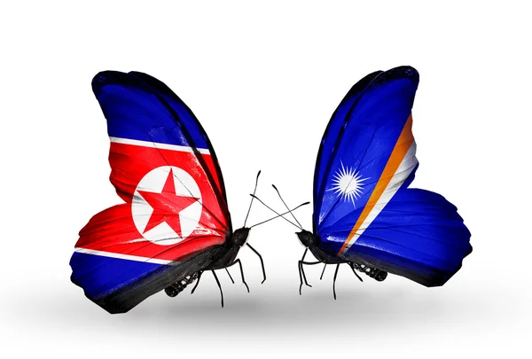 Papillons avec des drapeaux de Corée du Nord et des îles Marshall sur les ailes — Photo