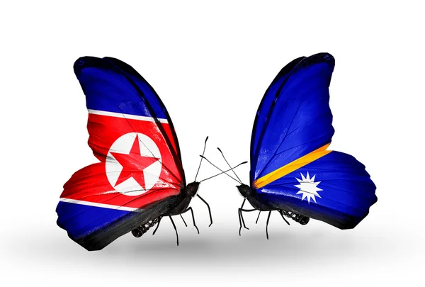 Borboletas com bandeiras da Coreia do Norte e Nauru em asas — Fotografia de Stock