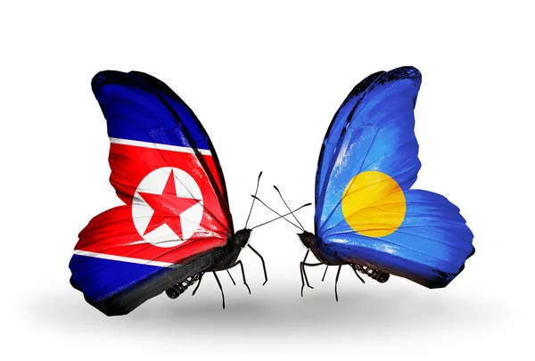 Papillons avec des drapeaux nord-coréens et palaos sur les ailes — Photo