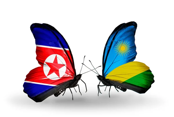 朝鲜与卢旺达国旗上的翅膀的蝴蝶 — 图库照片