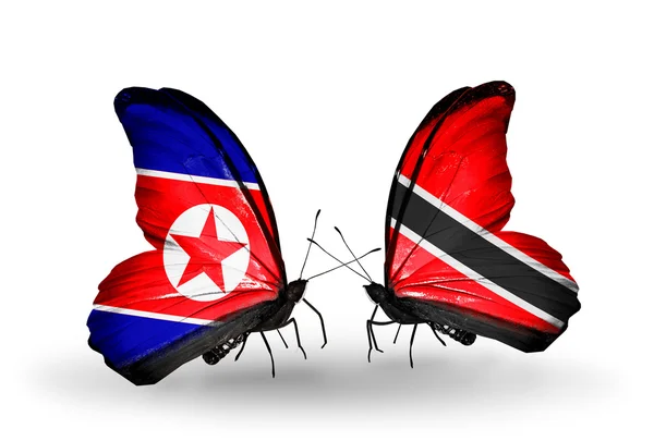 Mariposas con banderas de Corea del Norte y Trinidad y Tobago en alas —  Fotos de Stock