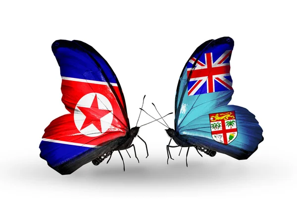 Papillons avec des drapeaux nord-coréens et fidjiens sur les ailes — Photo