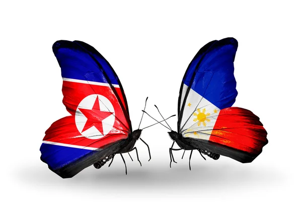 Papillons avec des drapeaux de Corée du Nord et des Philippines sur les ailes — Photo