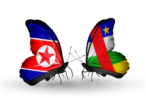 Mariposas con banderas de Corea del Norte y República Centroafricana en alas — Foto de Stock